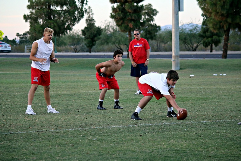 Team members begin to play football